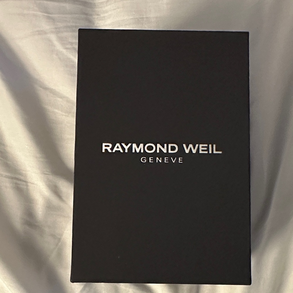 Raymond Weil two tone women’s watch in a sleek brown box! Brand new!